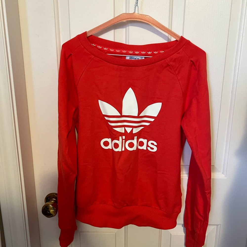 Adidas Woman’s long sleeves sweater.